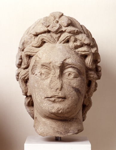 Kopf eines Genius mit Hiebspuren aus Bad Wimpfen (Landesmuseum Württemberg, Stuttgart CC BY-SA)