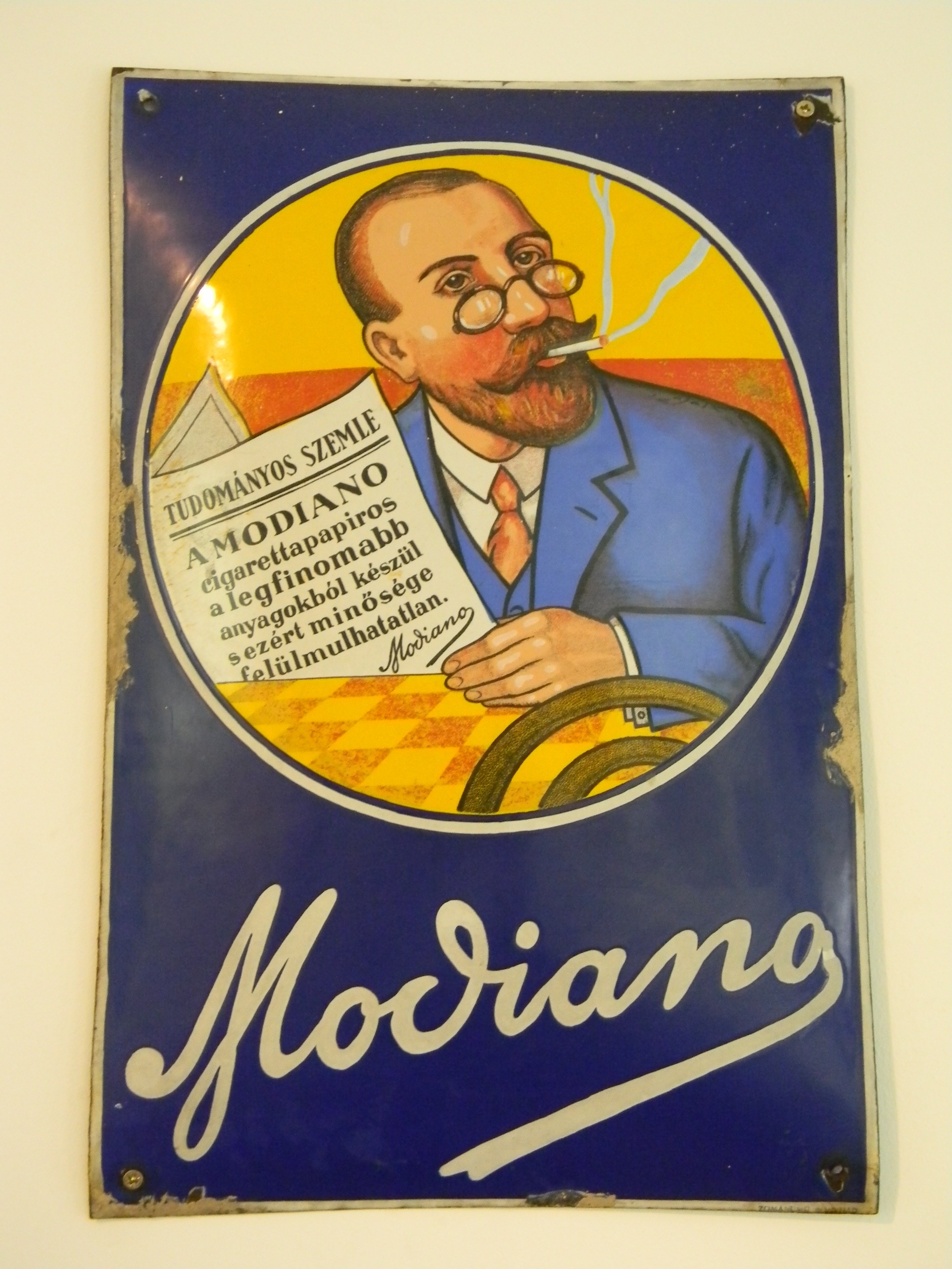 Modiano szivarkapapír és hüvely reklámtábla (Magyar Kereskedelmi és Vendéglátóipari Múzeum CC BY-NC-SA)