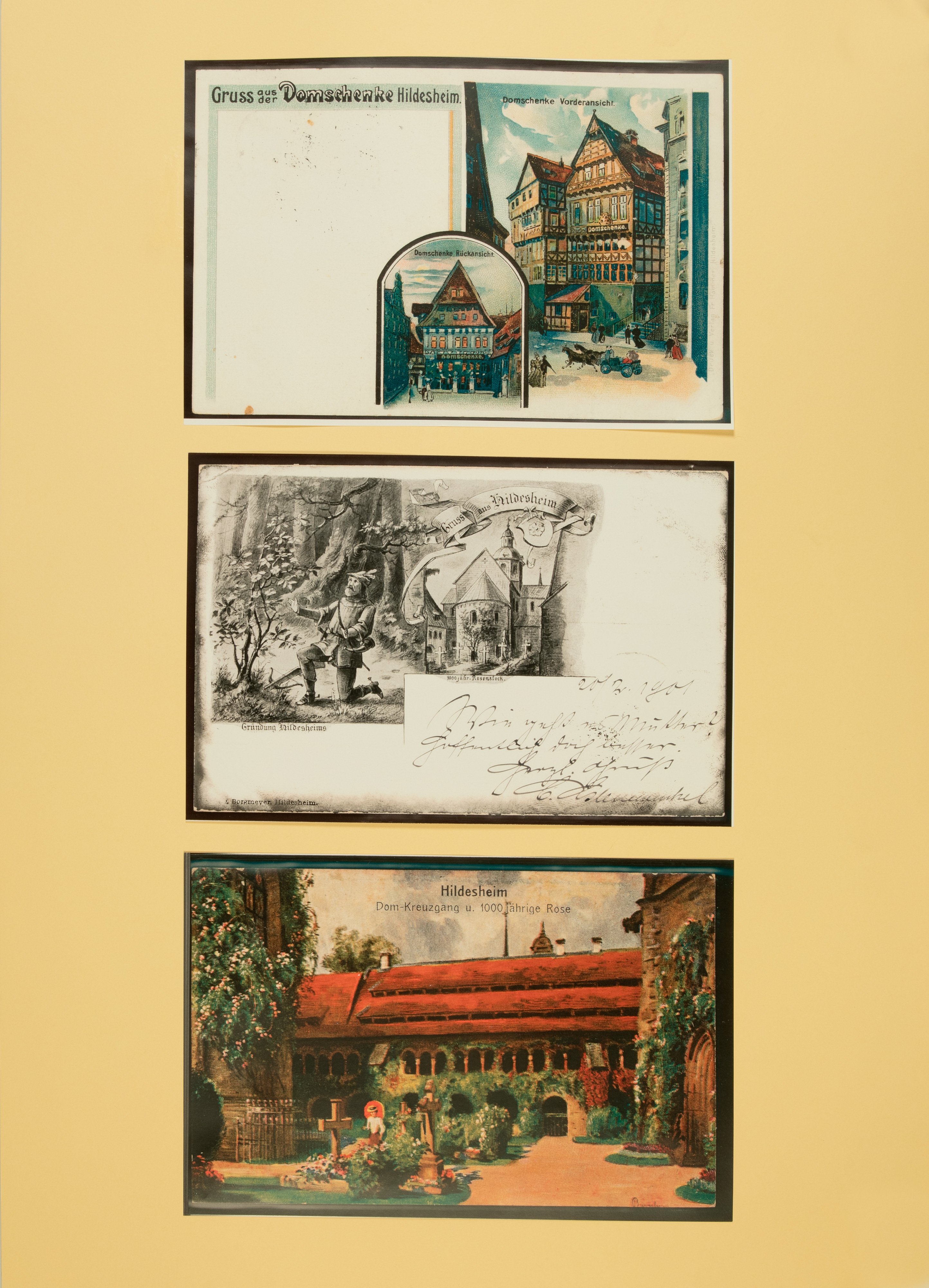 Wandbild mit Grußkarten aus Hildesheim mit Abbildungen von der Domschenke und dem Dom-Kreuzgang (Stiftung Schulmuseum der Universität Hildesheim CC BY-SA)
